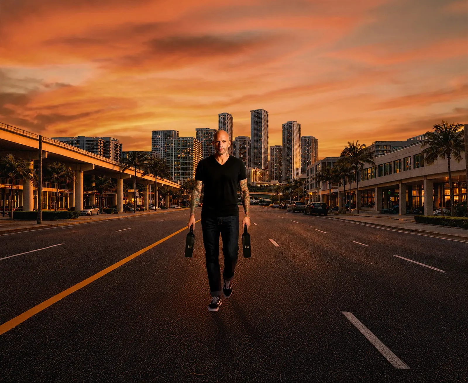 Ami James walking through Miami with the two INKspired bottles